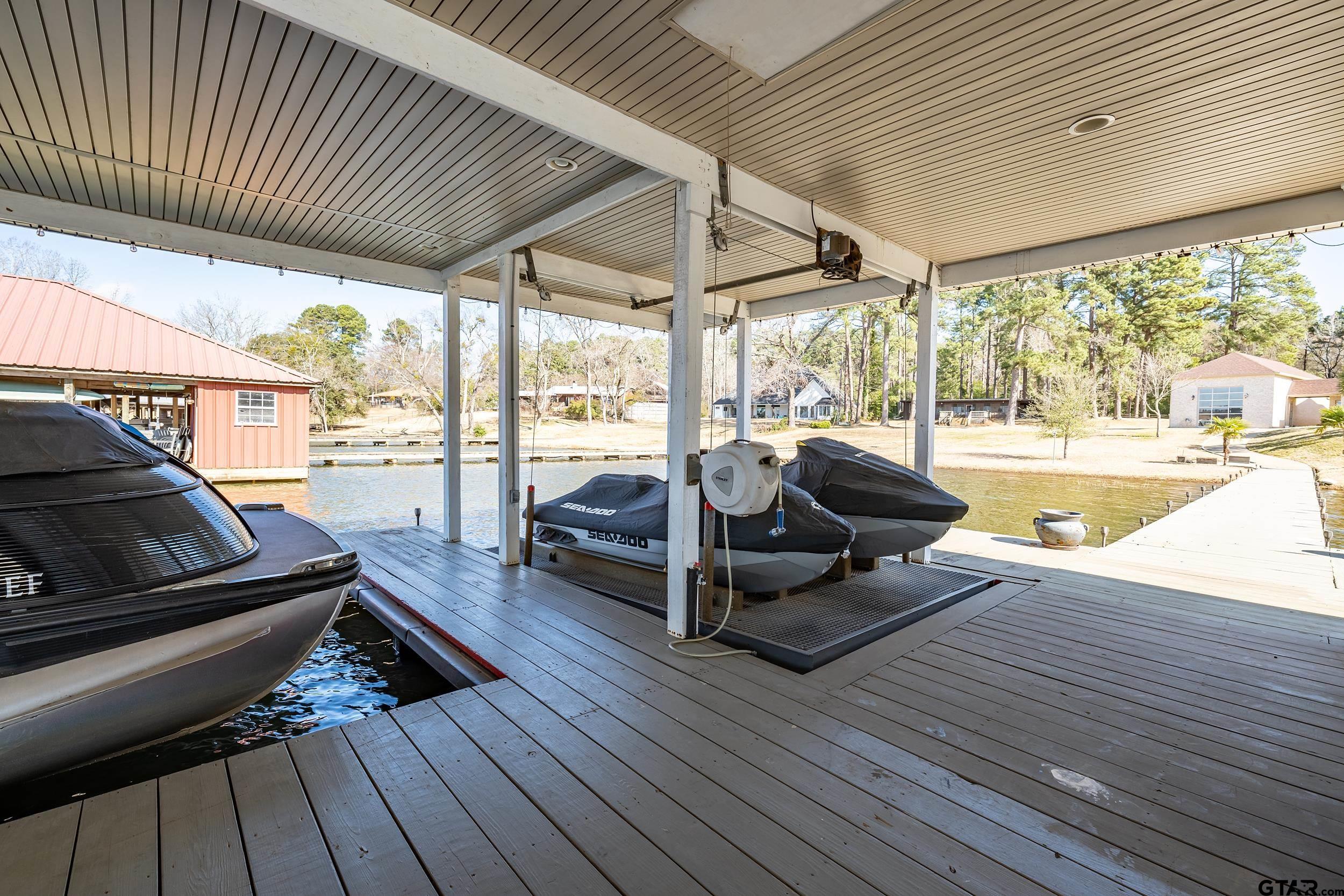 13793 Peninsula Road Whitehouse, TX 75791 - Photo 43 of 48 a living room with patio furniture and a wooden floor