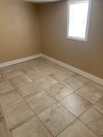 a view of a room that has a window in it