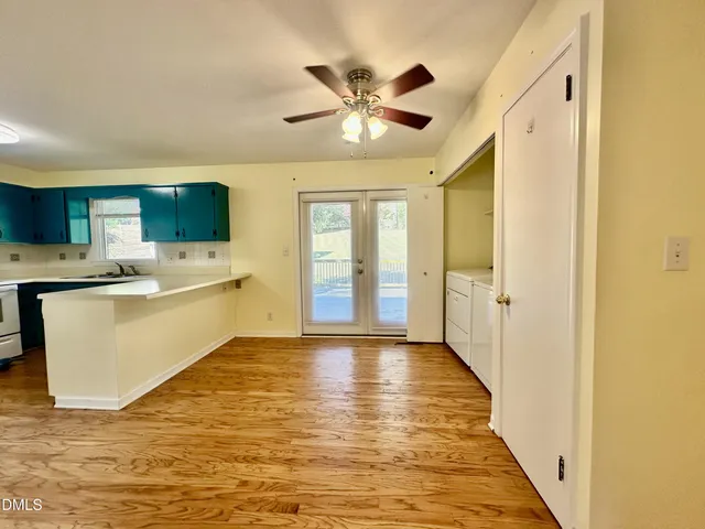 a view of a kitchen with a sink and a window