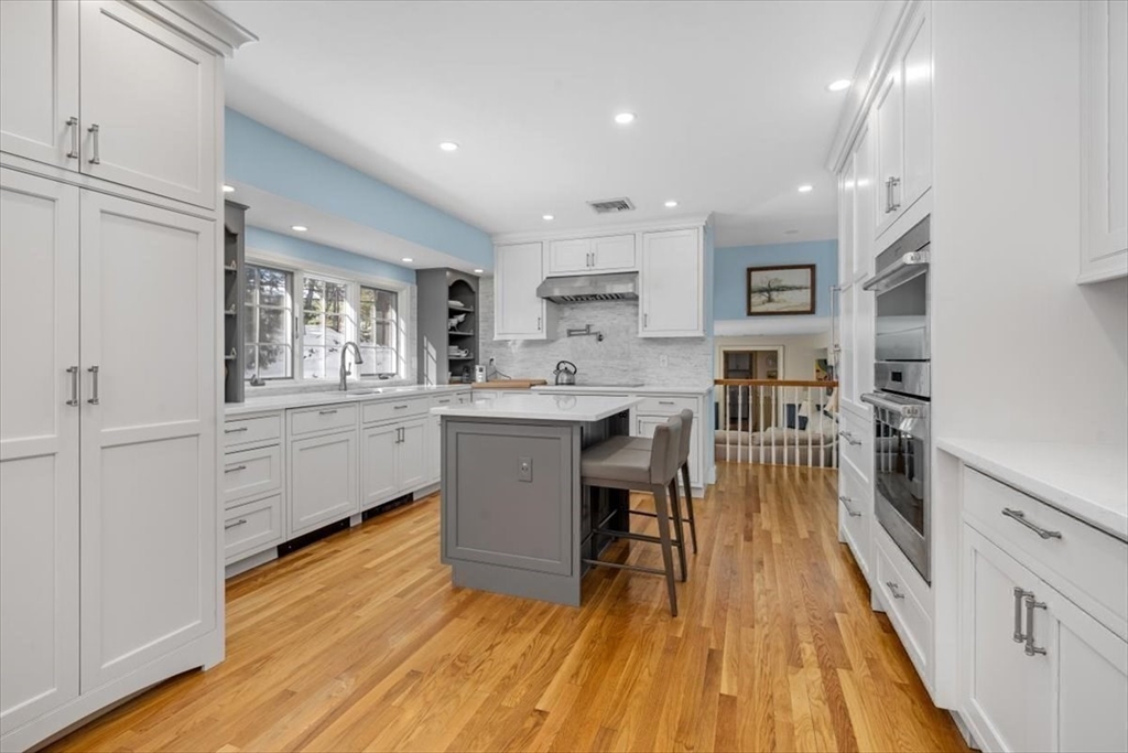 5 Old County Road Hingham, MA 02043 - Photo 13 of 42 a kitchen with counter top space a sink appliances and cabinets