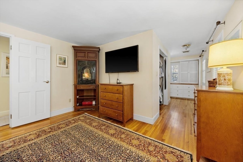 5 Old County Road Hingham, MA 02043 - Photo 26 of 42 a living room with furniture and a flat screen tv