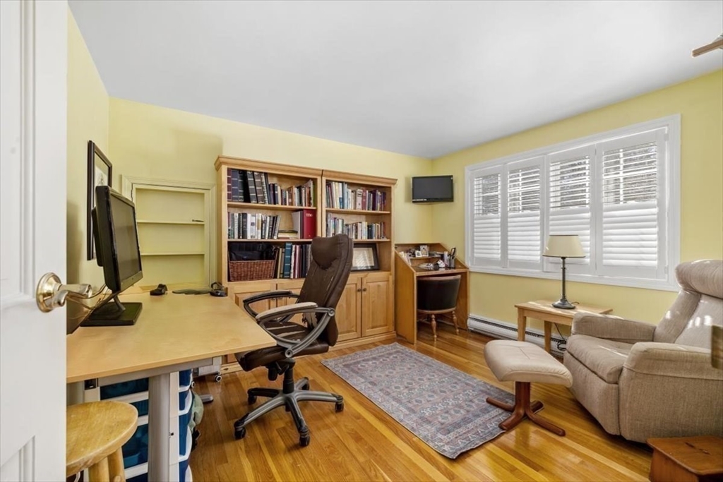 5 Old County Road Hingham, MA 02043 - Photo 29 of 42 a view of a workspace with furniture and a window
