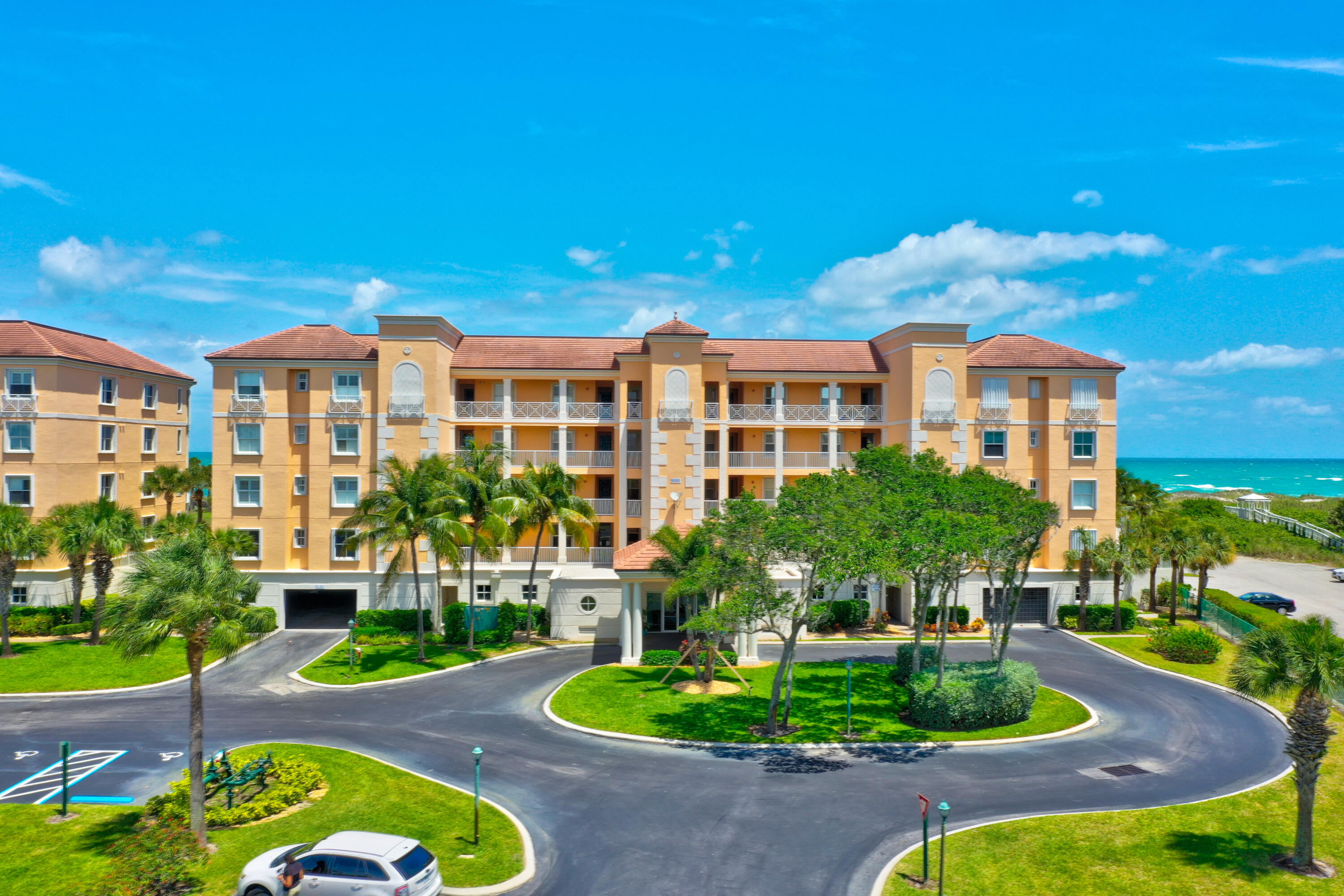 1002 Windward Drive Fort Pierce, FL 34949 - Photo 103 of 122 a front view of a house with a yard and potted plants