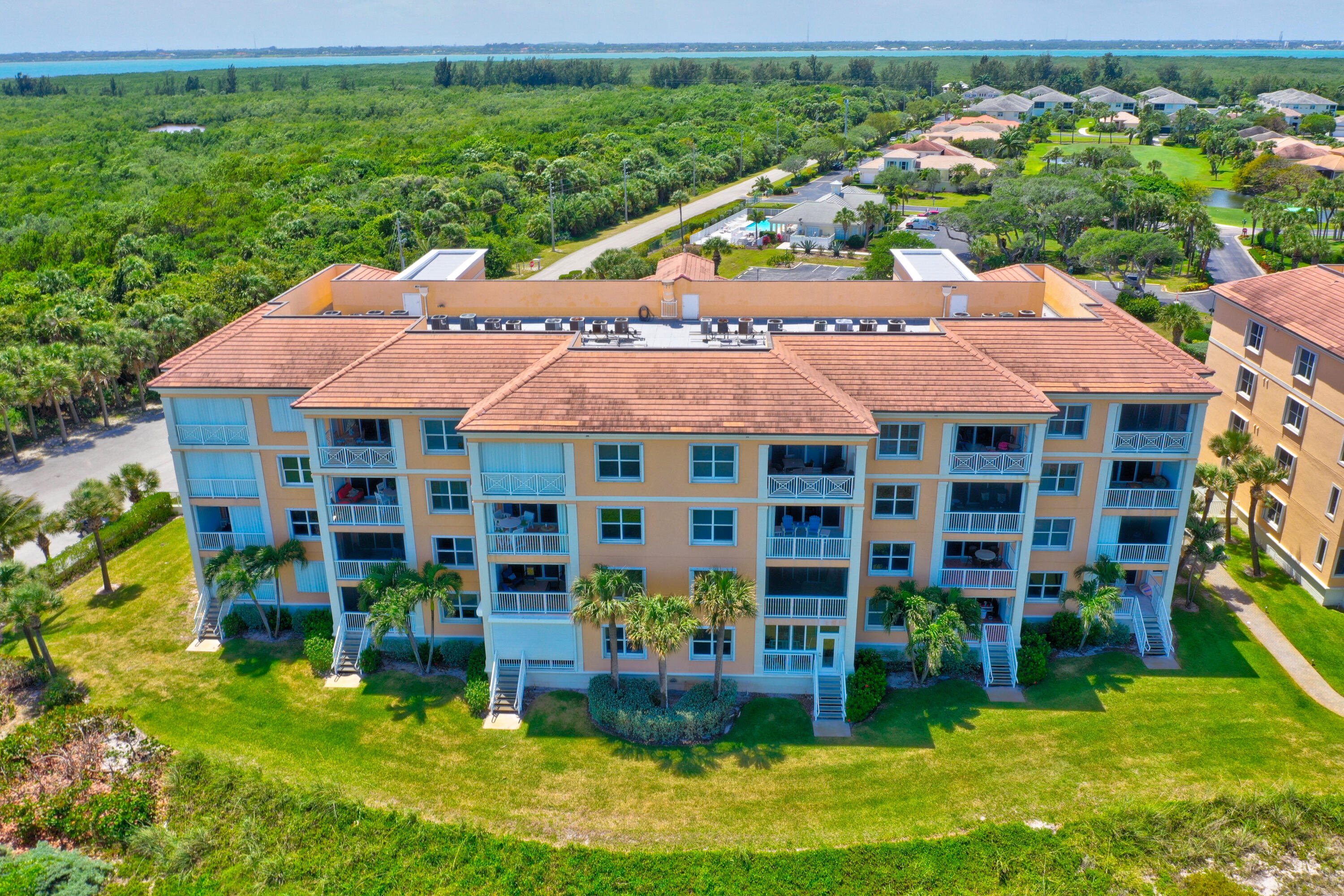 1002 Windward Drive Fort Pierce, FL 34949 - Photo 112 of 122 a view of a house with garden space and a swimming pool