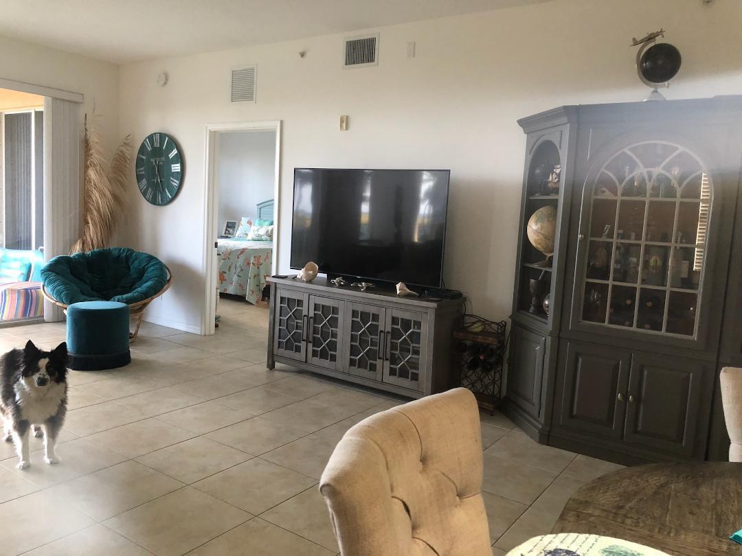 1002 Windward Drive Fort Pierce, FL 34949 - Photo 26 of 122 a living room with furniture and a flat screen tv