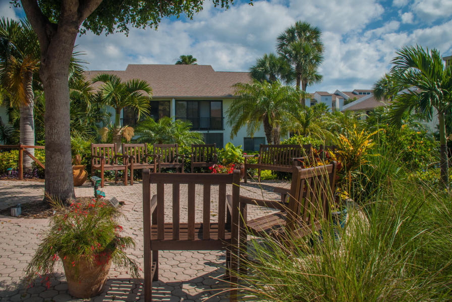 1002 Windward Drive Fort Pierce, FL 34949 - Photo 39 of 122 a view of a chair and table in the patio