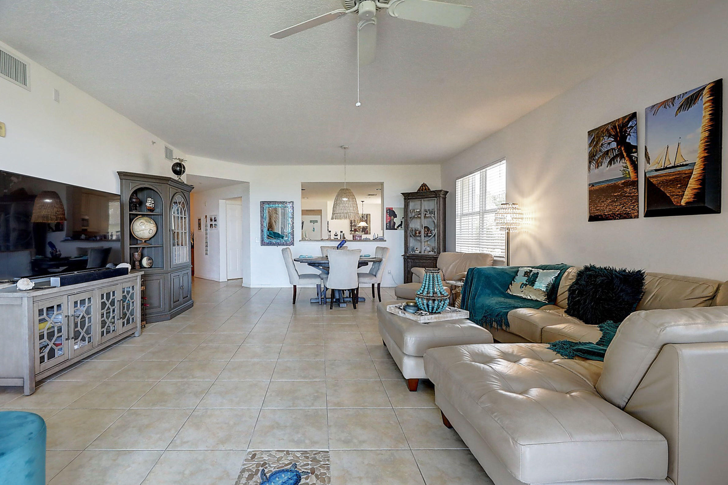 1002 Windward Drive Fort Pierce, FL 34949 - Photo 80 of 122 a living room with furniture and a flat screen tv