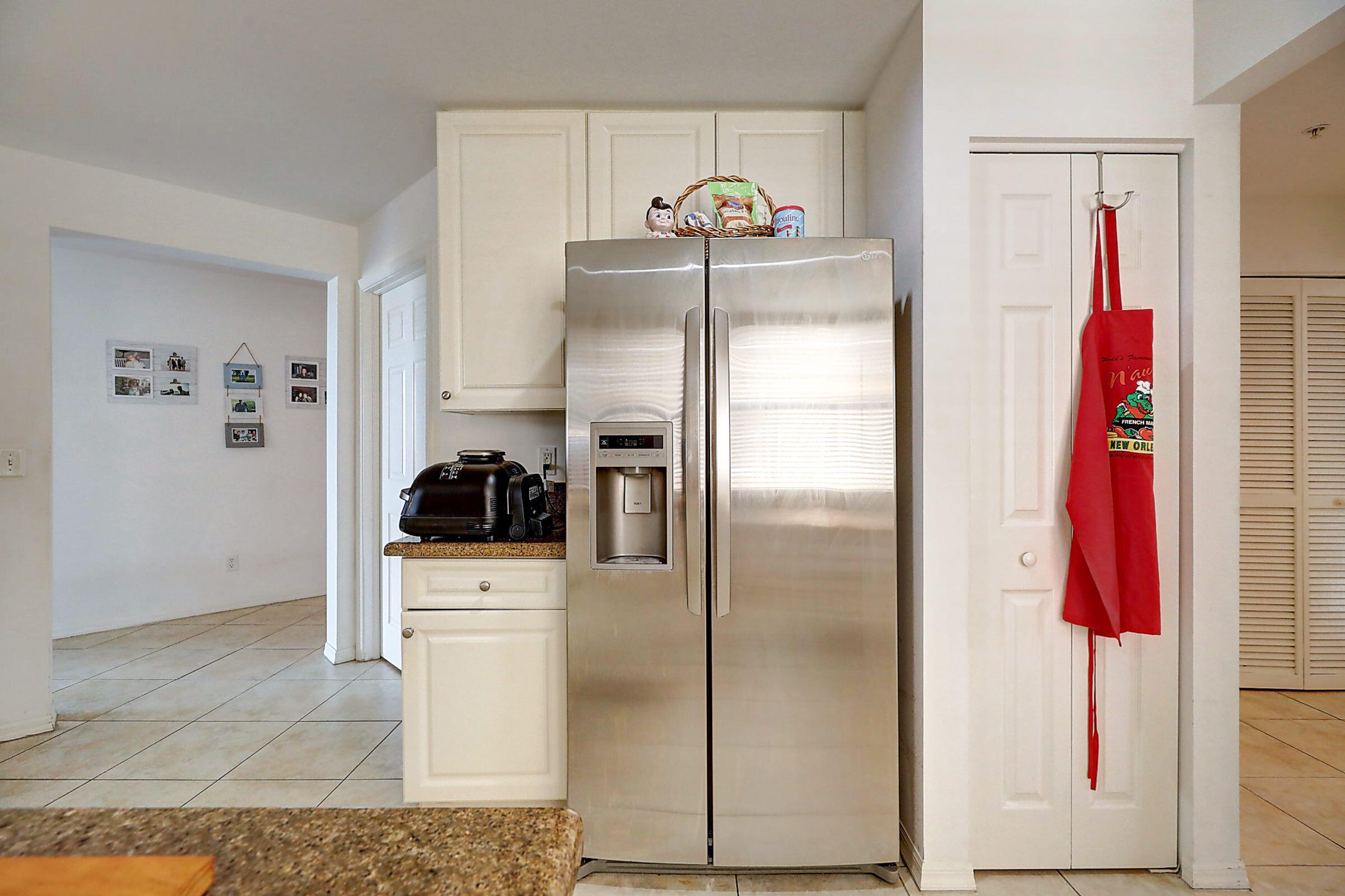 1002 Windward Drive Fort Pierce, FL 34949 - Photo 91 of 122 a kitchen with a refrigerator and a stove