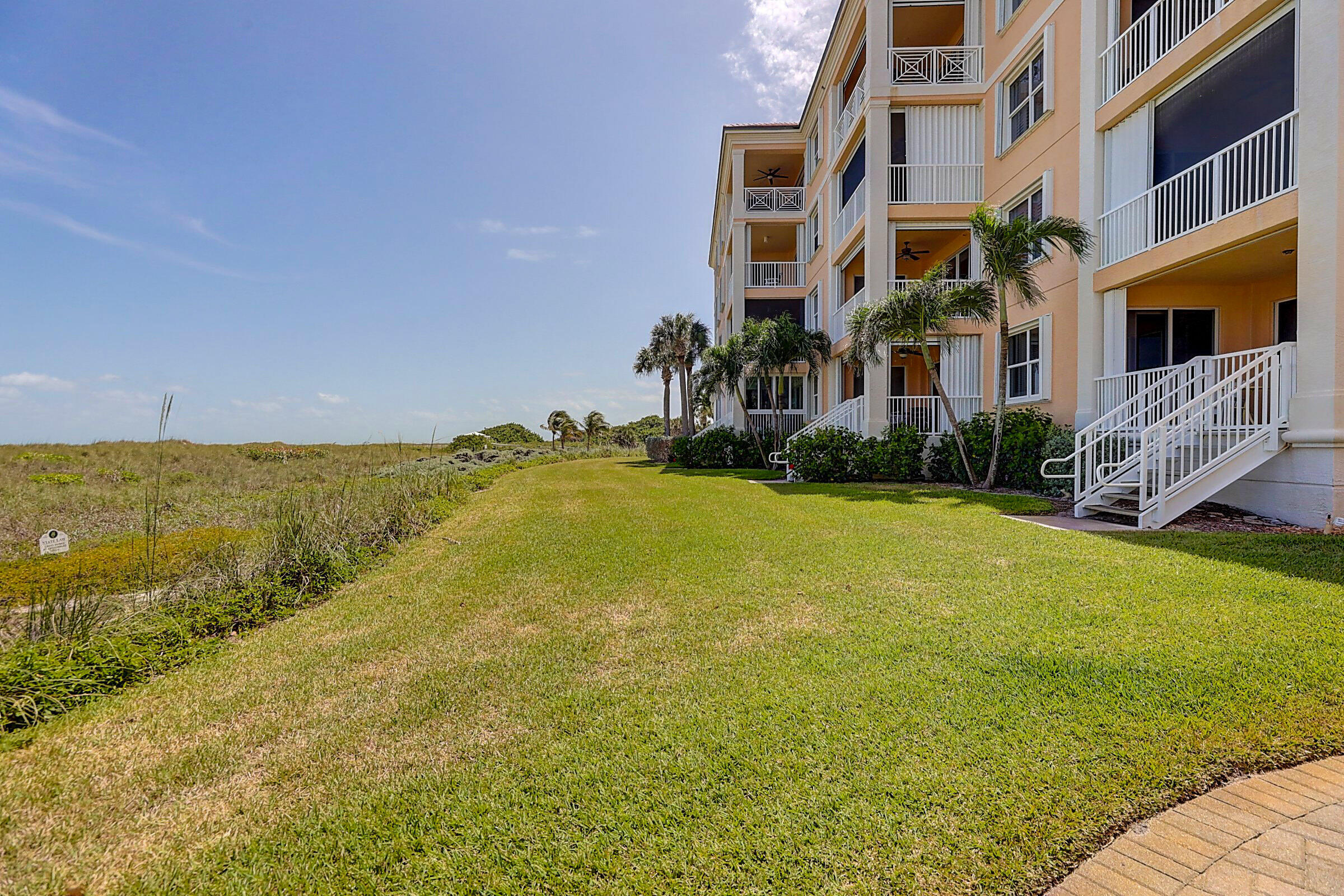 1002 Windward Drive Fort Pierce, FL 34949 - Photo 94 of 122 a view of an ocean with a building