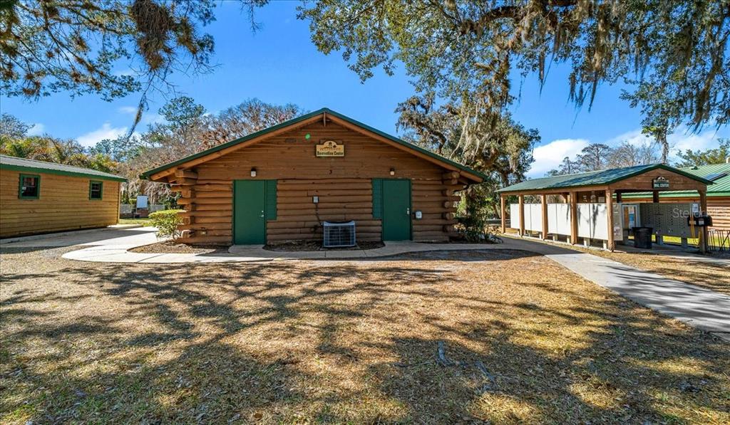3259 Northeast 102nd Ave Road Silver Springs, FL 34488 - Photo 57 of 99 a front view of a house with a yard