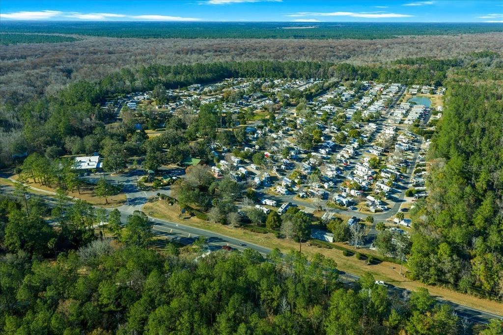 3259 Northeast 102nd Ave Road Silver Springs, FL 34488 - Photo 97 of 99 a view of a city with lush green forest