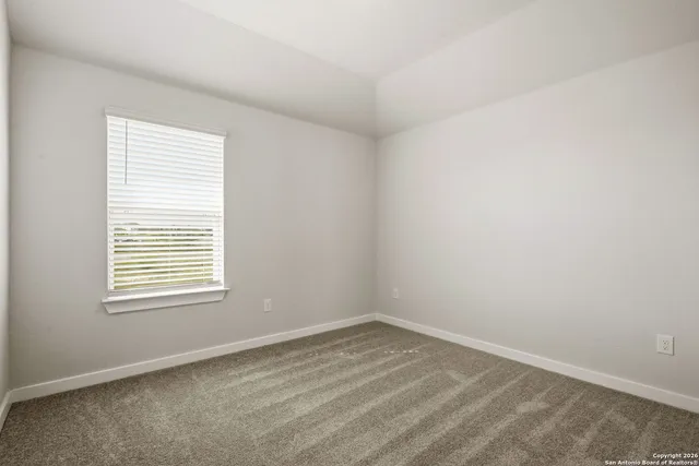 a bathroom with a granite countertop sink a toilet and bathtub
