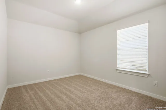a view of a balcony with furniture