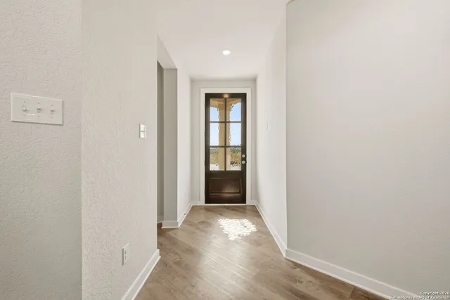 a view of an entryway of wooden floor