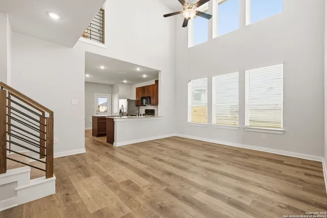a view of kitchen and window with wooden floor