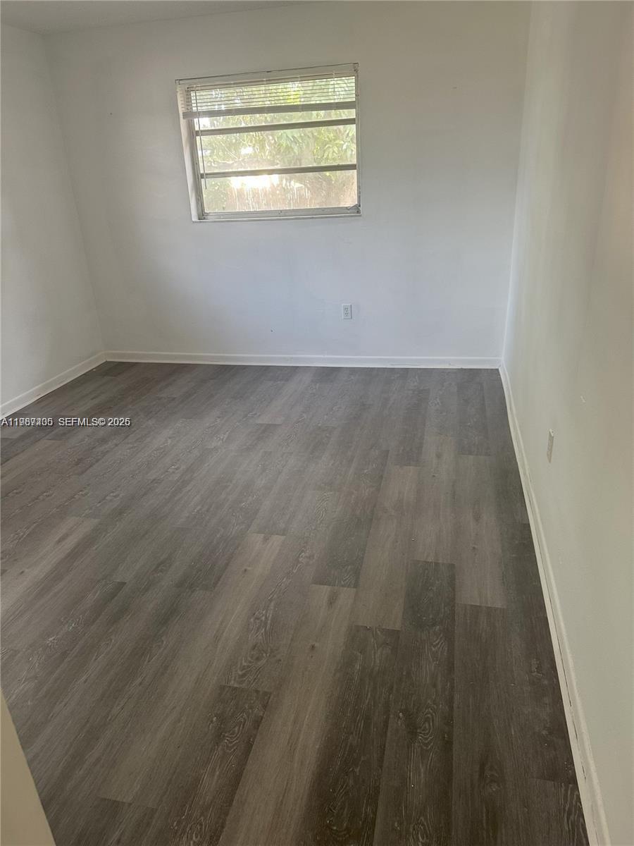 3268 Southwest 25th Street, Unit 3268 Miami, FL 33133 - Photo 12 of 17 an empty room with a window