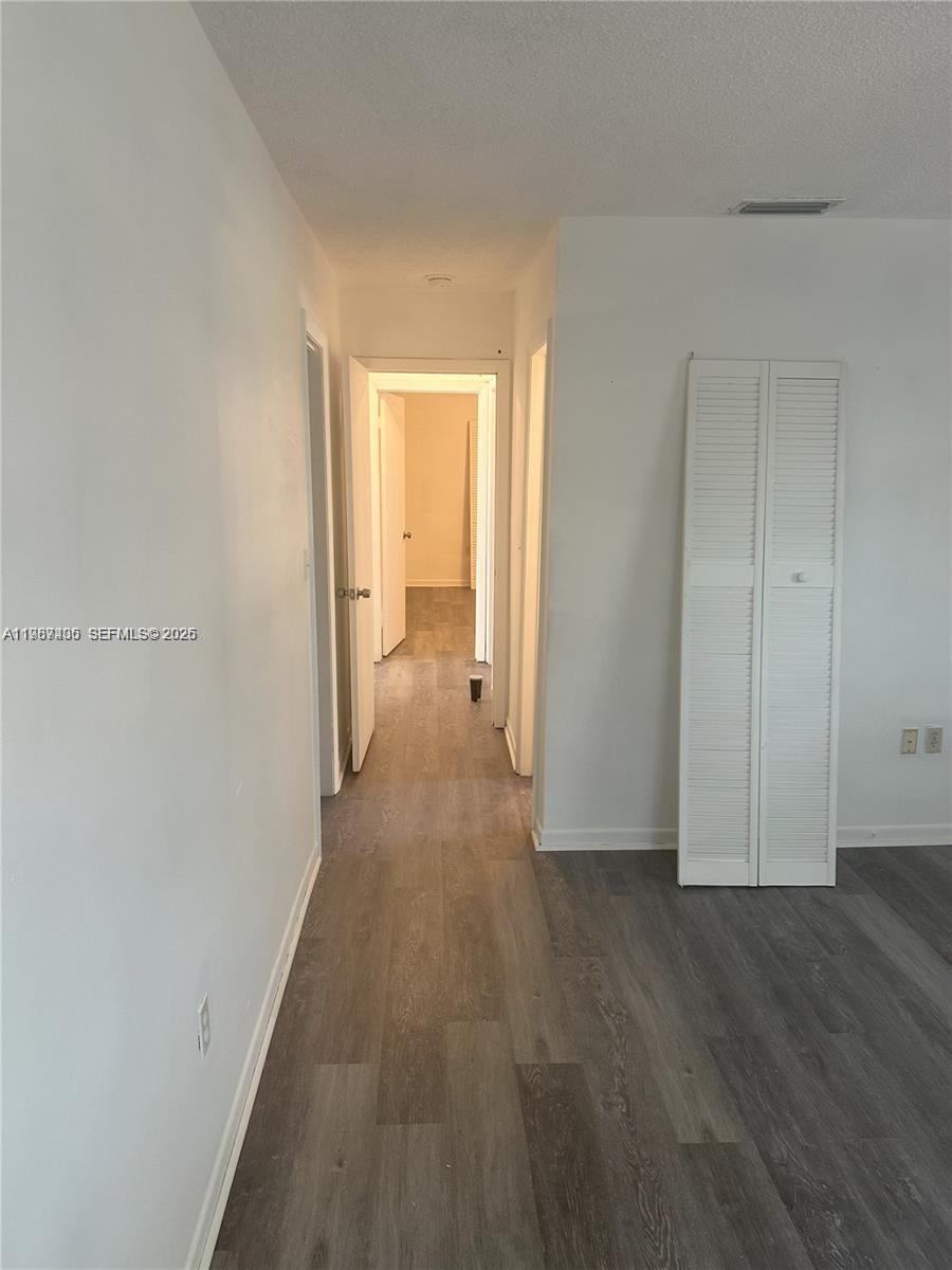 3268 Southwest 25th Street, Unit 3268 Miami, FL 33133 - Photo 7 of 17 a view of a room with wooden floor