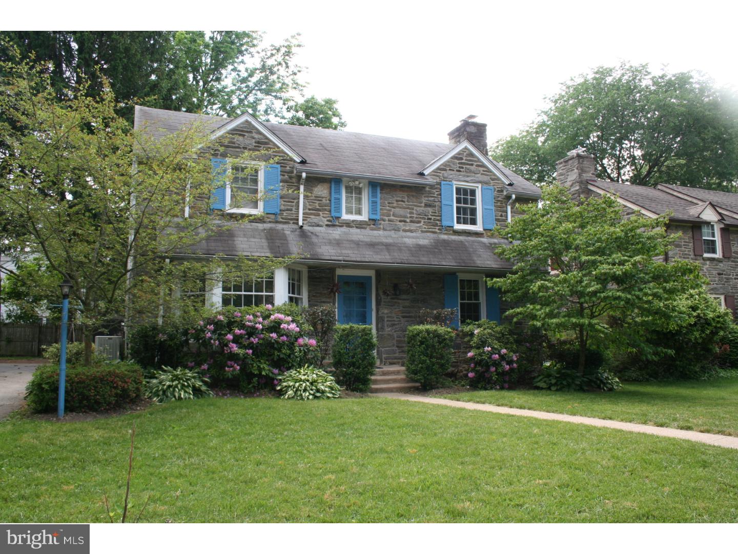 144 Henley Road Wynnewood, PA 19096 - Photo 2 of 21 a front view of a house with a garden