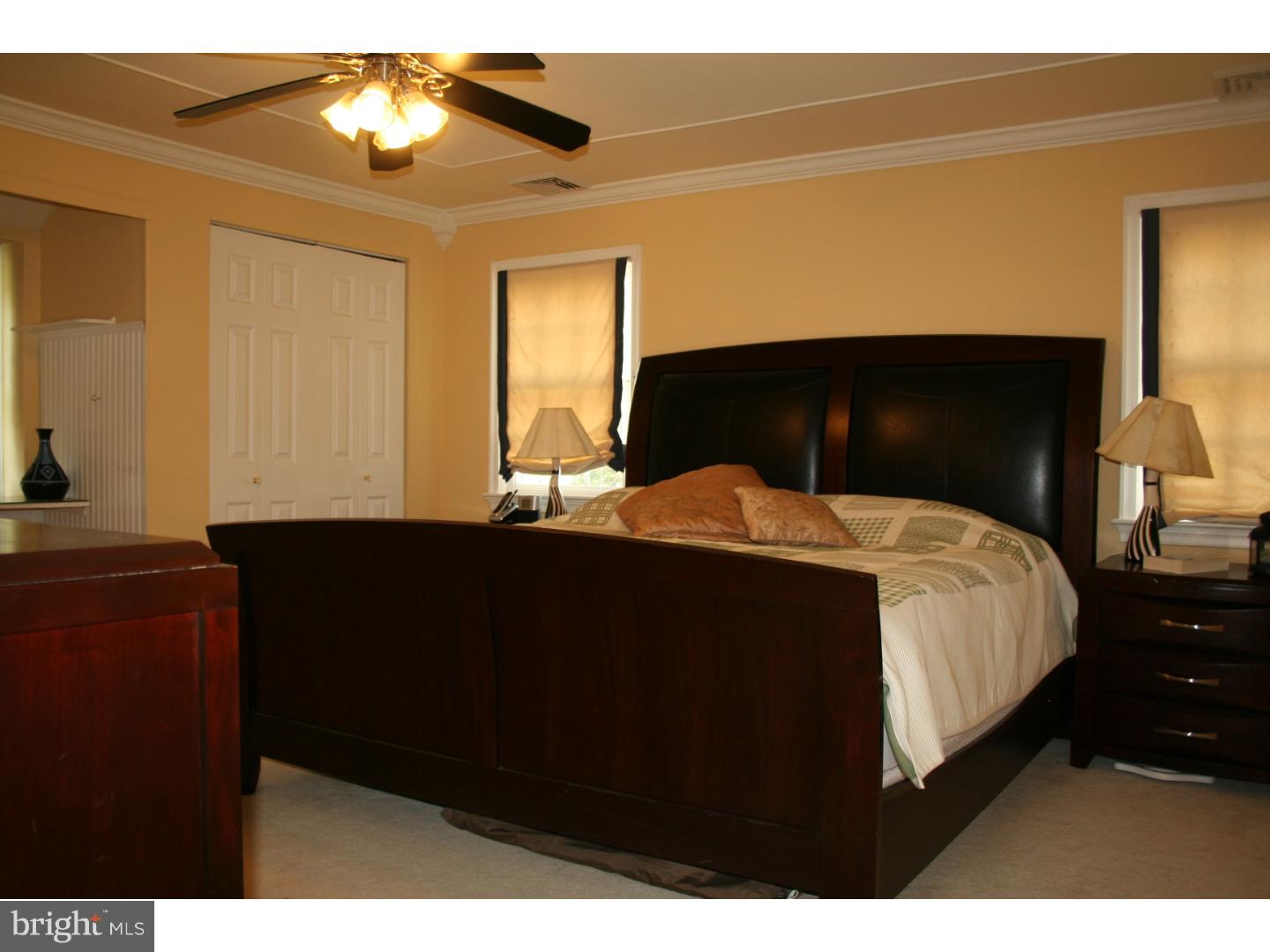 144 Henley Road Wynnewood, PA 19096 - Photo 14 of 21 a bedroom with a bed and a chandelier