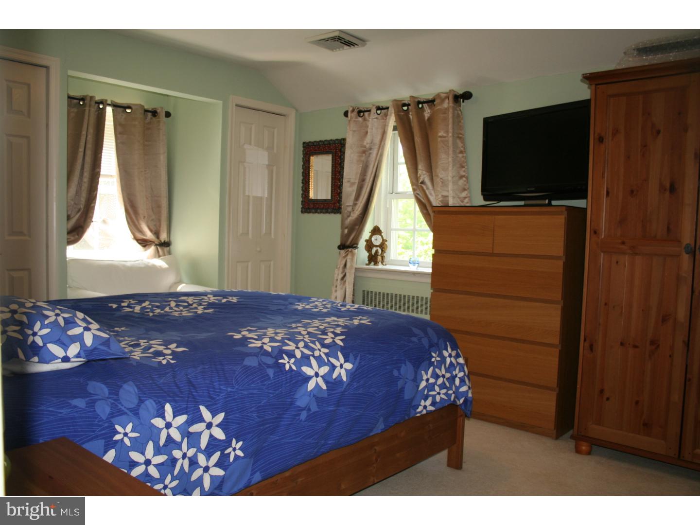 144 Henley Road Wynnewood, PA 19096 - Photo 16 of 21 a bedroom with a bed and a flat screen tv
