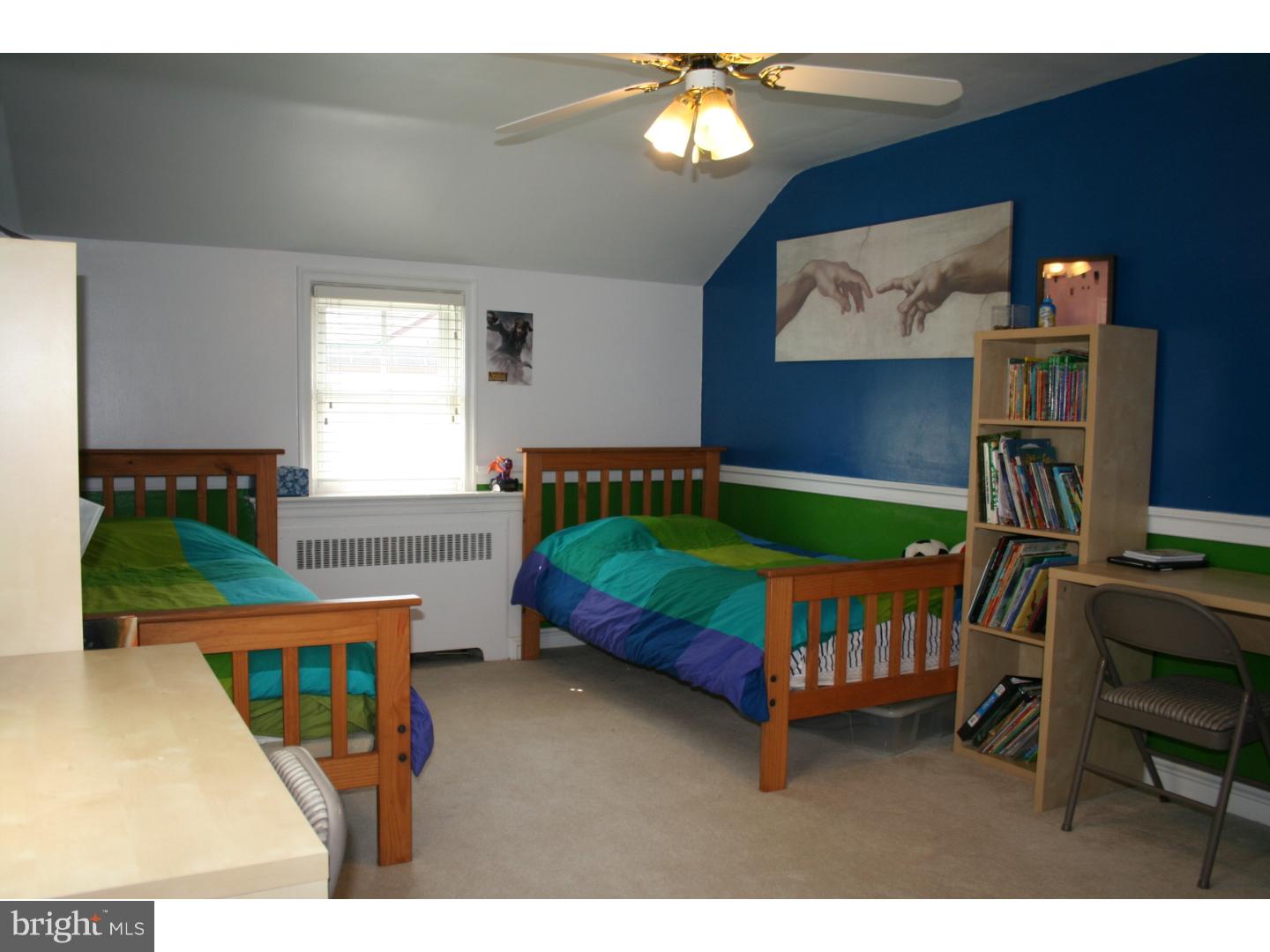144 Henley Road Wynnewood, PA 19096 - Photo 17 of 21 a bedroom with furniture and a wooden floor