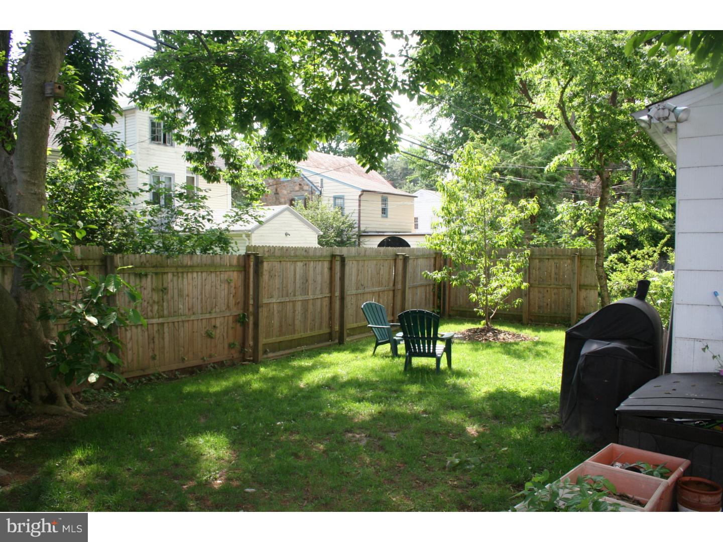 144 Henley Road Wynnewood, PA 19096 - Photo 20 of 21 a backyard of a house with table and chairs