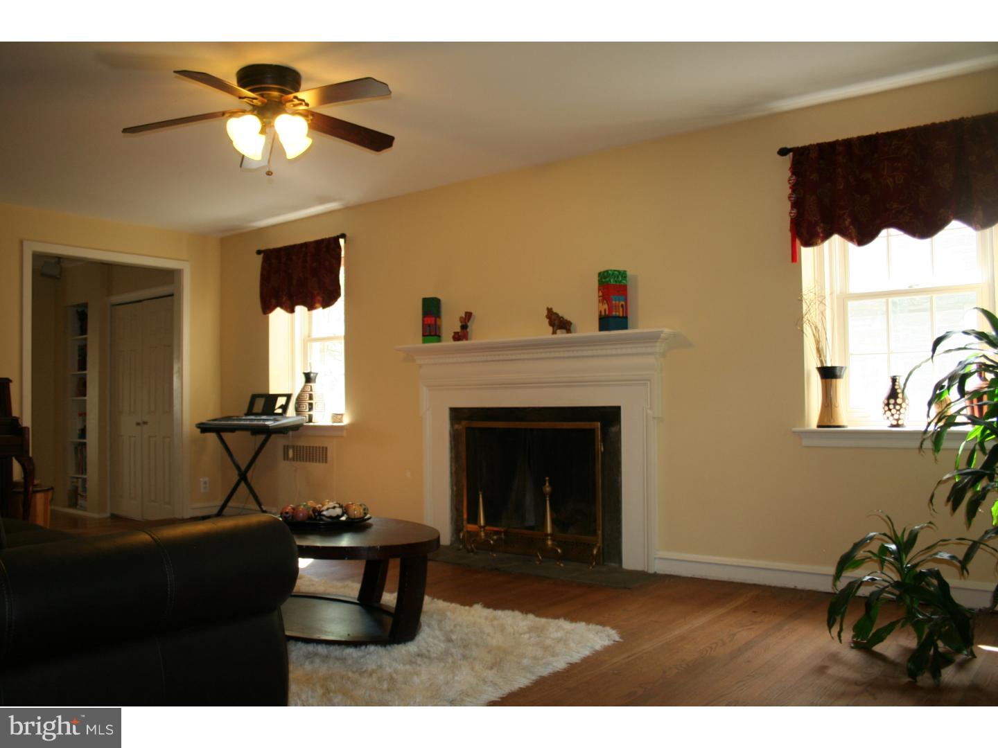 144 Henley Road Wynnewood, PA 19096 - Photo 3 of 21 a living room with furniture and a fireplace