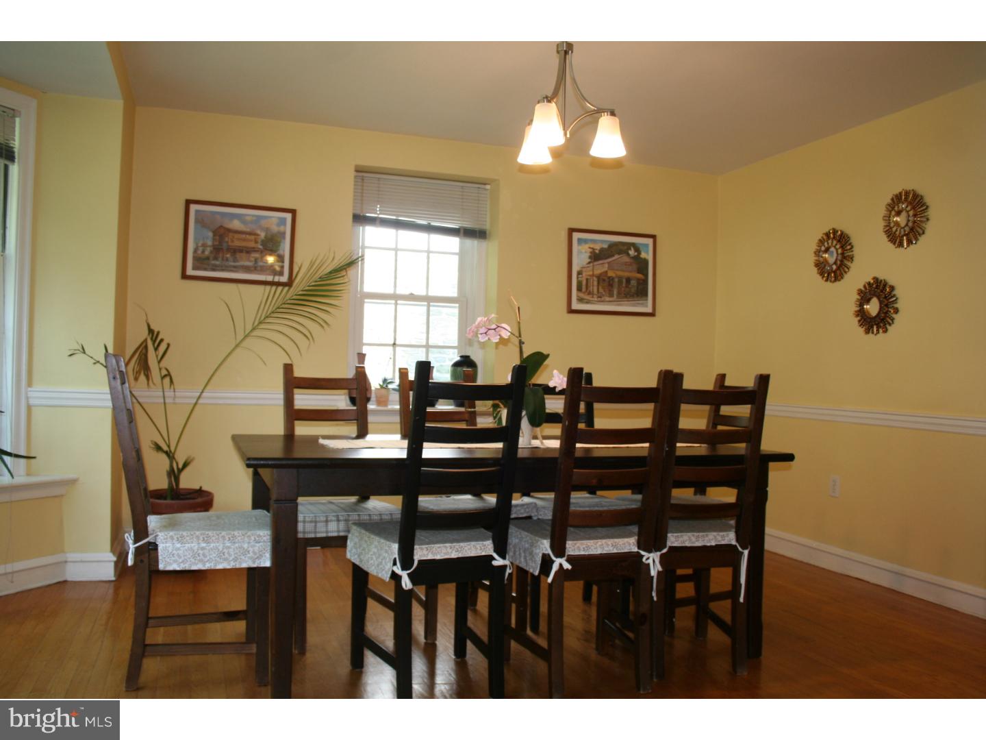 144 Henley Road Wynnewood, PA 19096 - Photo 5 of 21 a view of a dining room with furniture and wooden floor