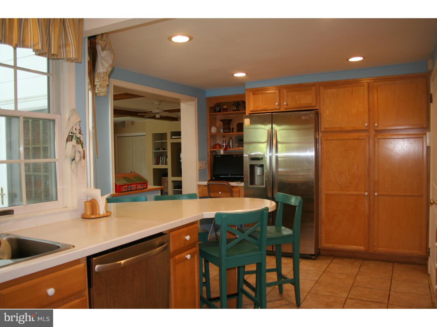 144 Henley Road Wynnewood, PA 19096 - Photo 8 of 21 a kitchen with stainless steel appliances granite countertop a sink and a refrigerator