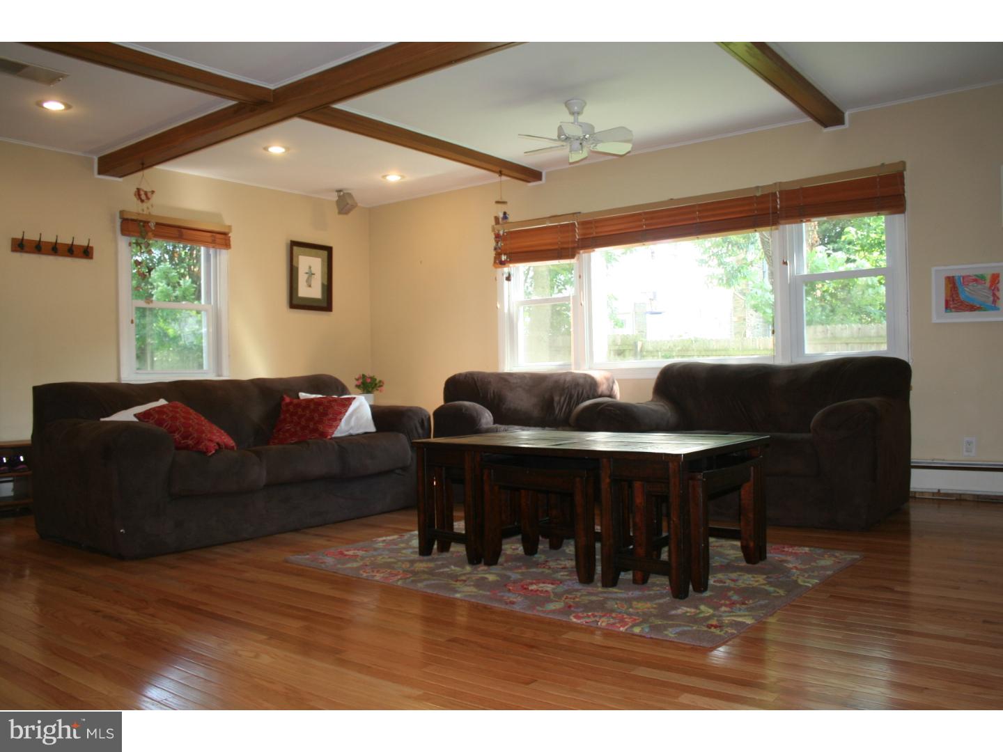 144 Henley Road Wynnewood, PA 19096 - Photo 10 of 21 a living room with furniture and a large window