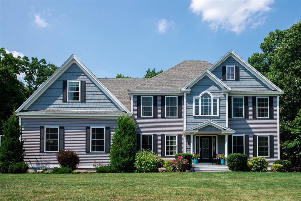 22 Jacob Road Windham, NH 03087 - Photo 1 of 42 a front view of a house with a yard