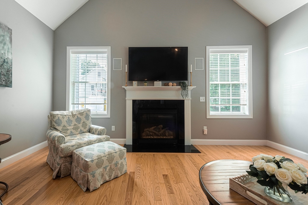 22 Jacob Road Windham, NH 03087 - Photo 12 of 42 a living room with furniture and a flat screen tv