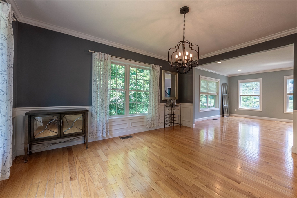 22 Jacob Road Windham, NH 03087 - Photo 14 of 42 a view of an empty room with wooden floor fireplace and a window