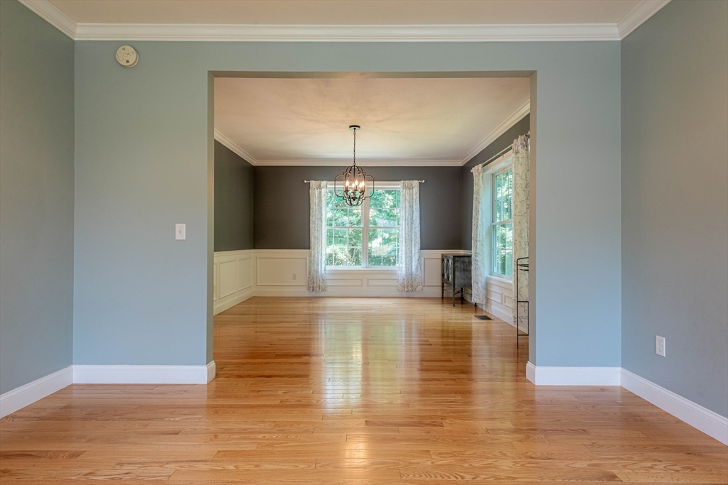 22 Jacob Road Windham, NH 03087 - Photo 16 of 42 a view of an empty room with window and wooden floor