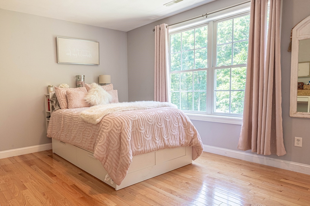 22 Jacob Road Windham, NH 03087 - Photo 24 of 42 a bed sitting in a bedroom next to a window