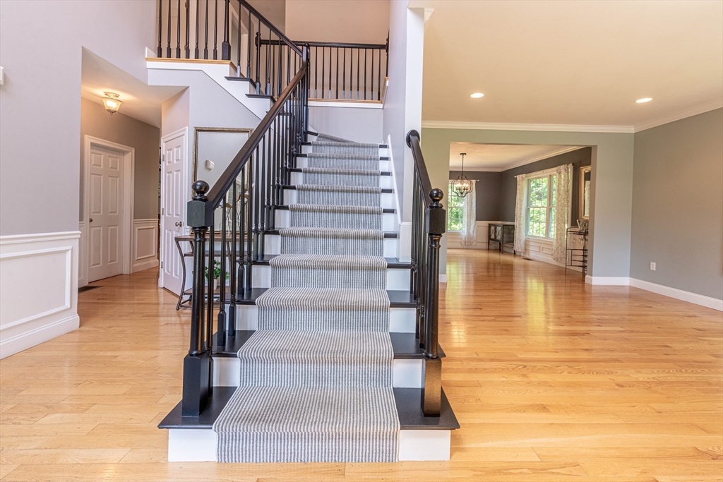 22 Jacob Road Windham, NH 03087 - Photo 3 of 42 a view of entryway and hall with wooden floor