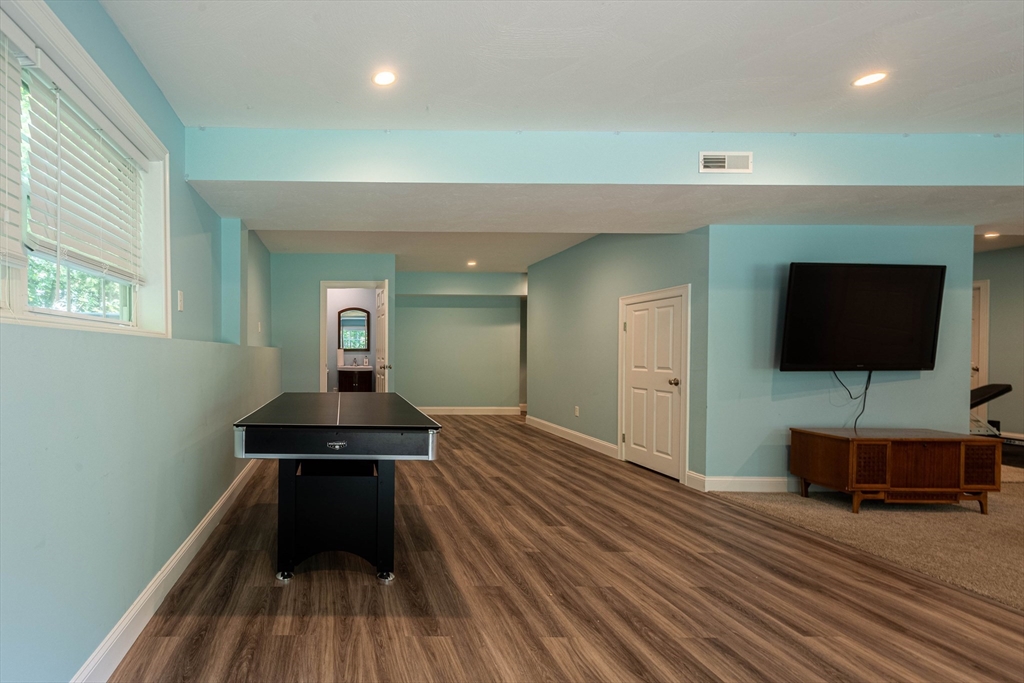 22 Jacob Road Windham, NH 03087 - Photo 36 of 42 a view of a livingroom with wooden floor and furniture