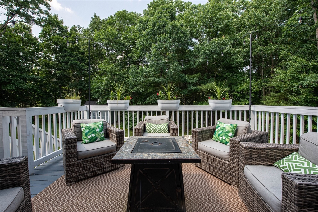 22 Jacob Road Windham, NH 03087 - Photo 38 of 42 a view of a chair and table on the roof deck