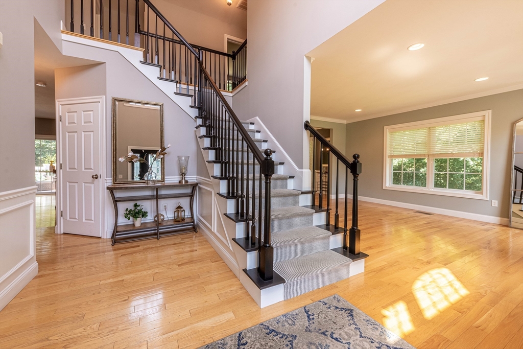 22 Jacob Road Windham, NH 03087 - Photo 4 of 42 a view of an entryway and hall with wooden floor