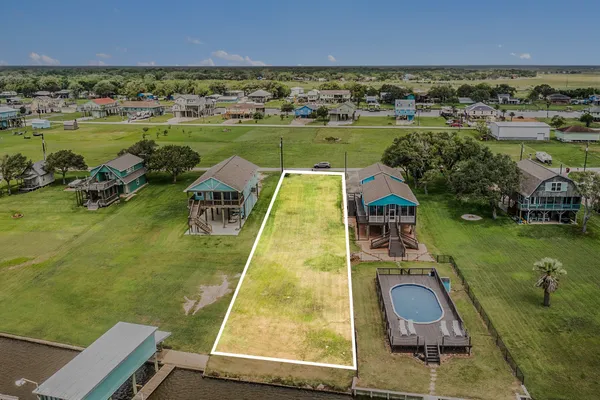 an aerial view of a house with a ocean view