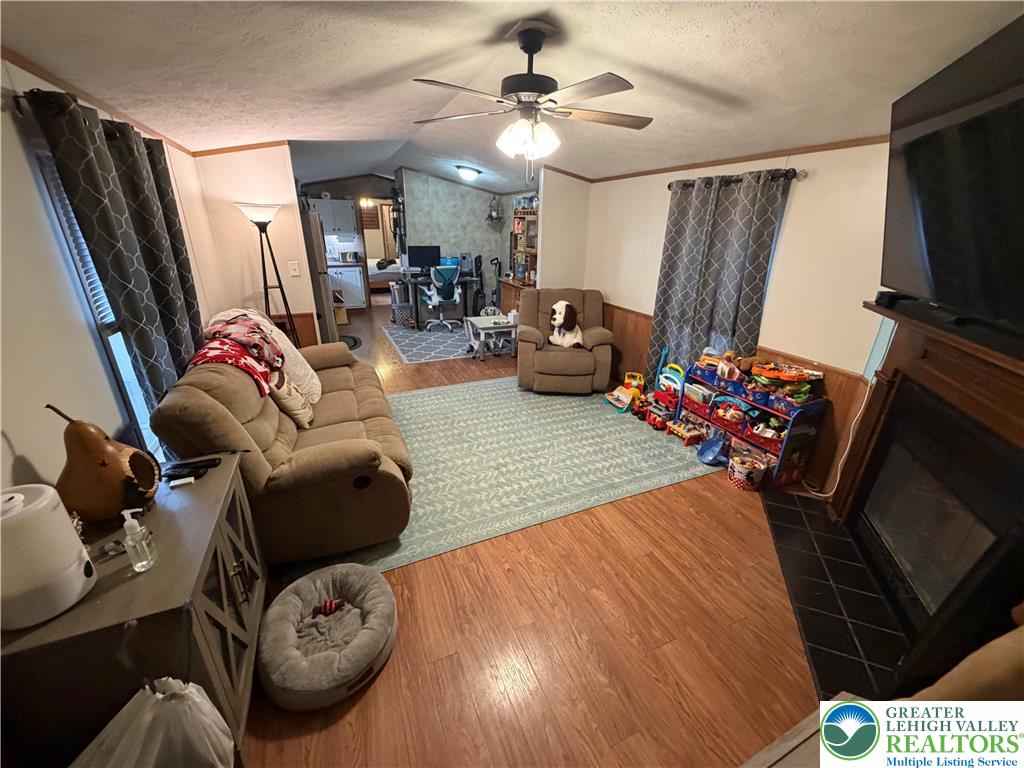 6318 Lamar Court Slatington, PA 18080 - Photo 6 of 18 a living room with furniture and a flat screen tv