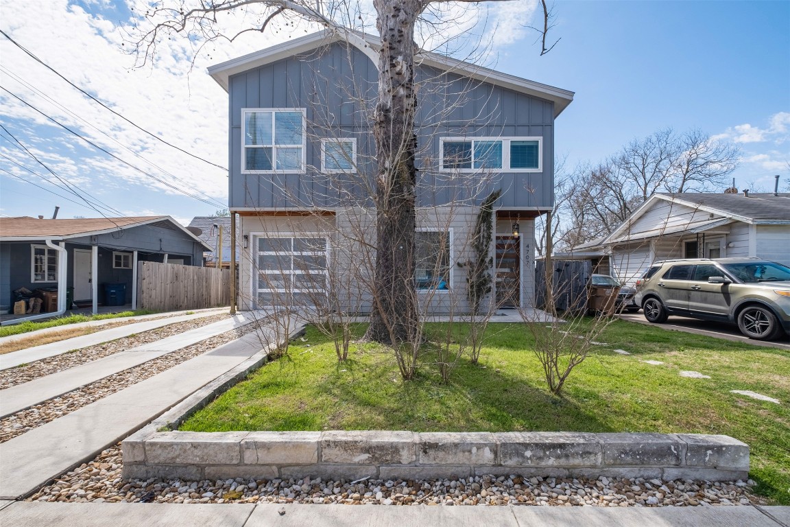 4707 Leslie Avenue, Unit A Austin, TX 78721 - Photo 2 of 24 Contemporary house with board and batten siding and concrete driveway