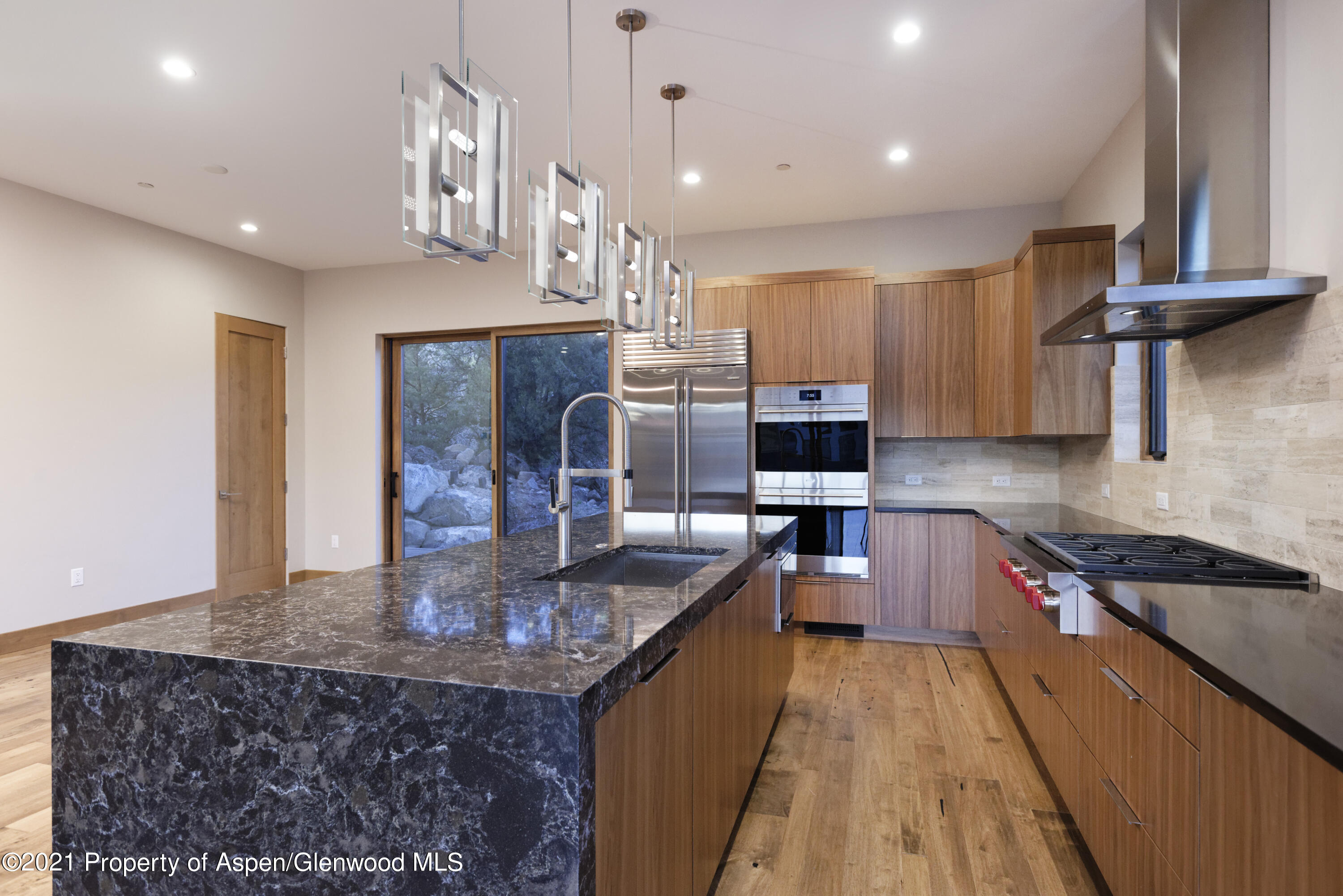 350 Overlook Ridge Basalt, CO 81621 - Photo 14 of 53 a kitchen with stainless steel appliances granite countertop a sink stove and refrigerator