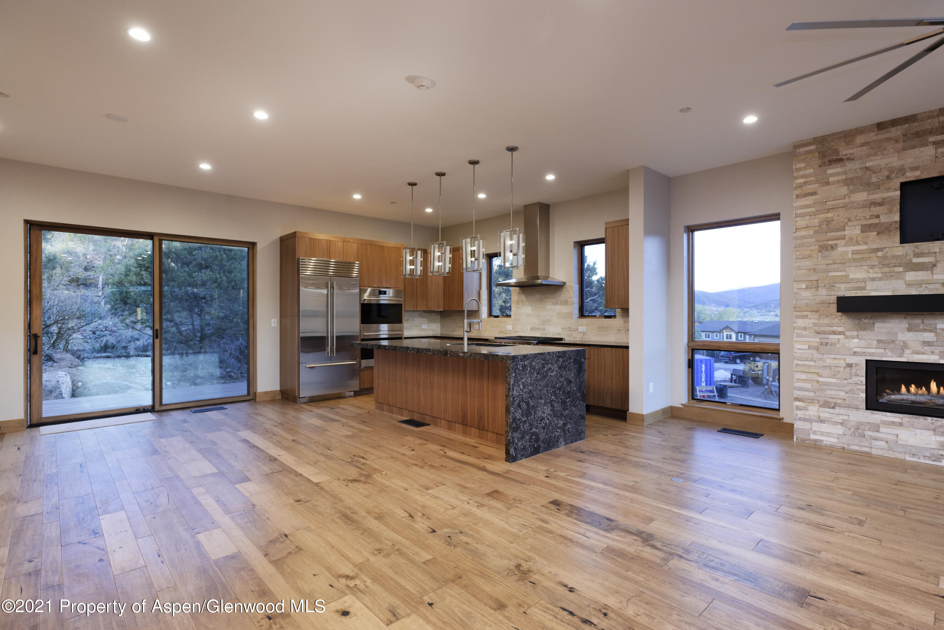 350 Overlook Ridge Basalt, CO 81621 - Photo 3 of 53 a large kitchen with stainless steel appliances granite countertop a large counter top and a wooden floors