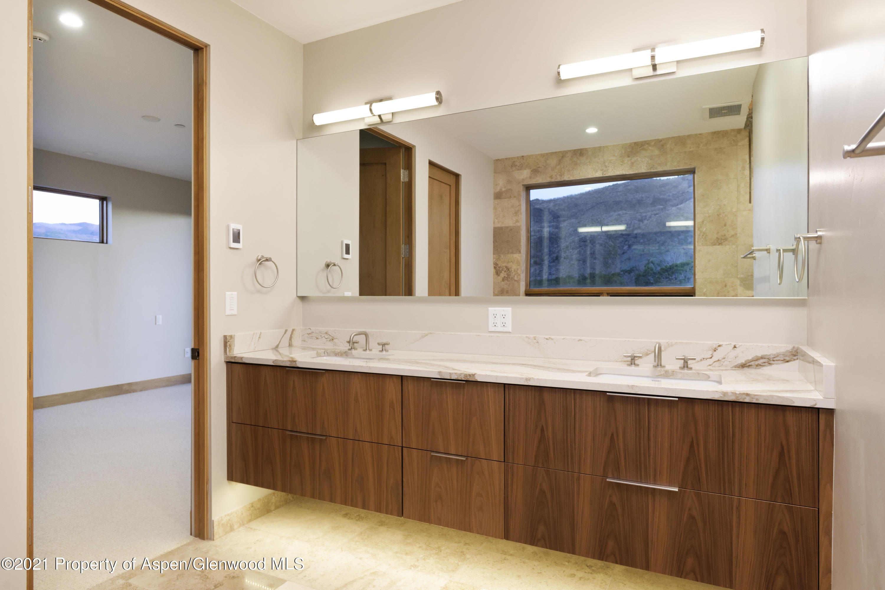 350 Overlook Ridge Basalt, CO 81621 - Photo 35 of 53 a bathroom with a double vanity sink and a mirror