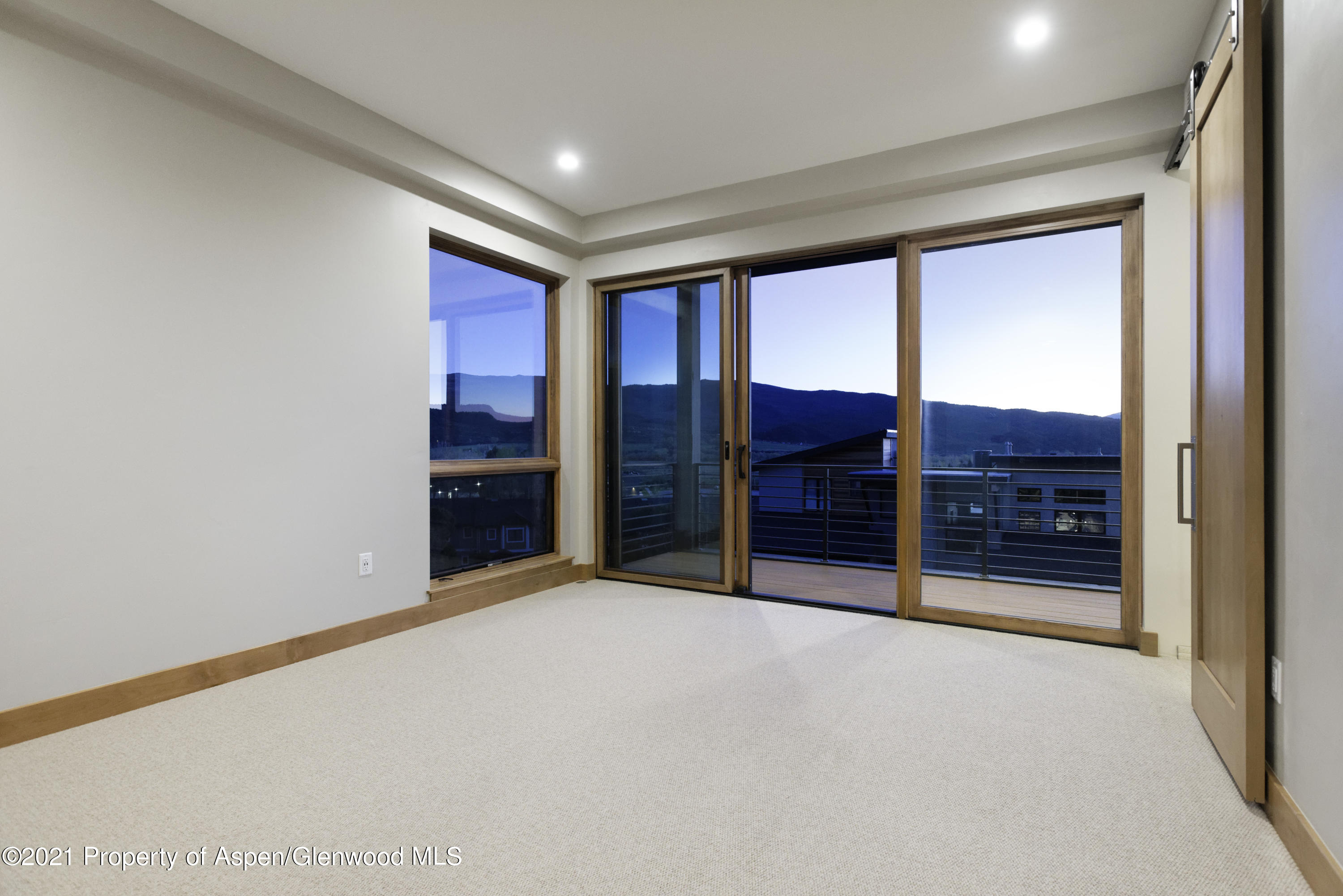 350 Overlook Ridge Basalt, CO 81621 - Photo 38 of 53 a big room with an empty room and fire place