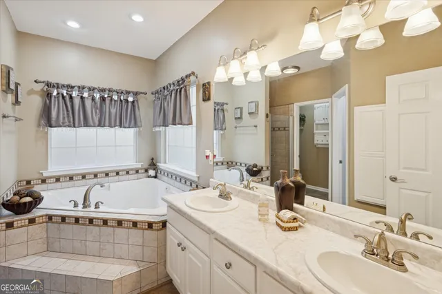 a bathroom with a double vanity sink mirror and double