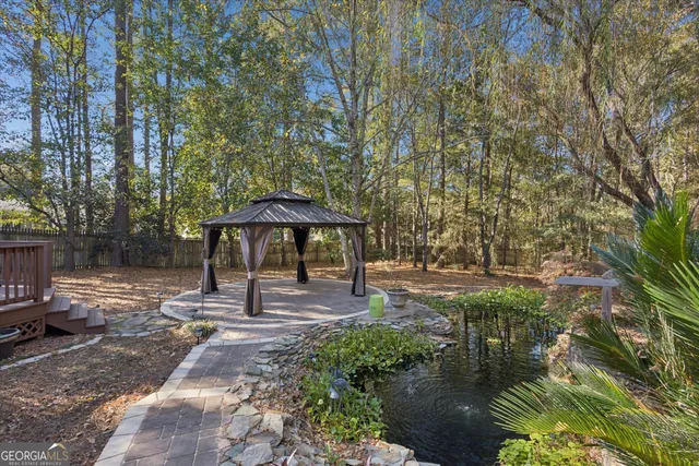 a view of a yard with large trees