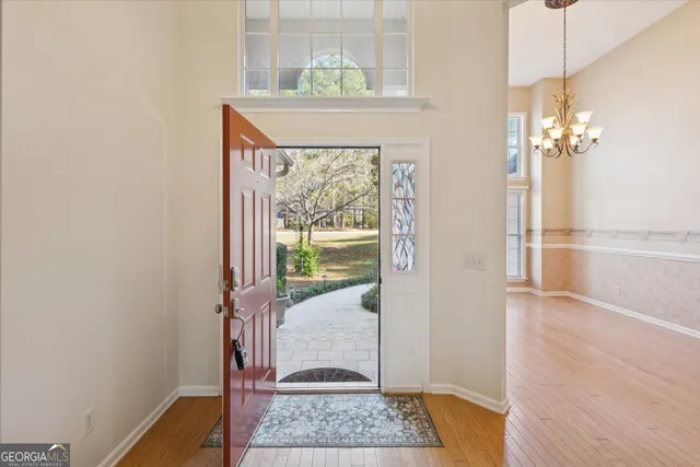 a view of entryway with wooden floor