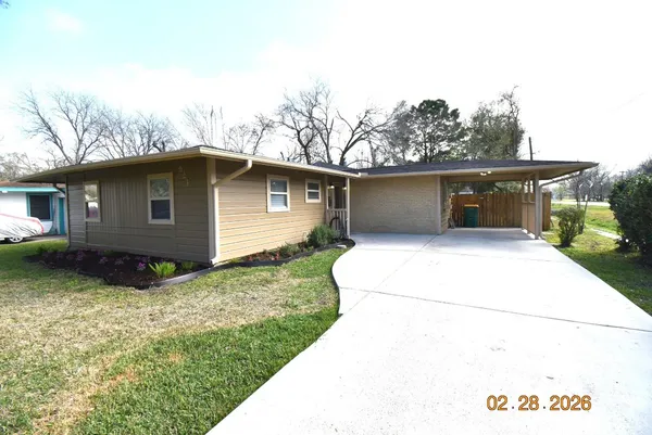 a house view with a backyard space